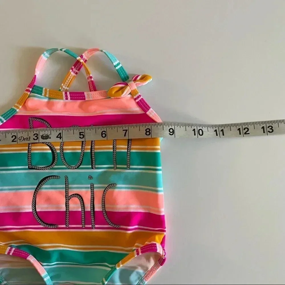 Koala Kids multi color bathing suit w/ “Born Chic” wording